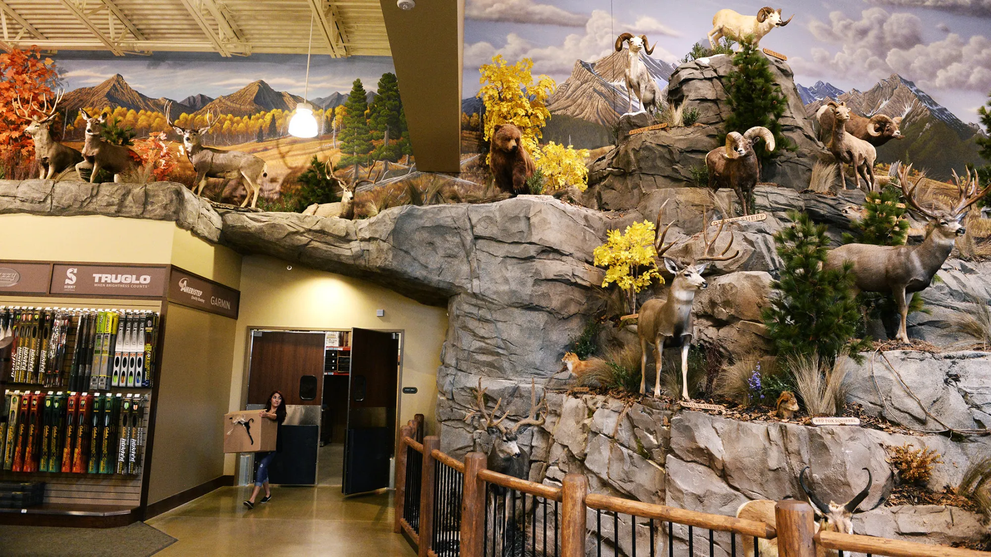 A Cabela's employee brings out boxes during set up of a store in Thornton, Colorado.
