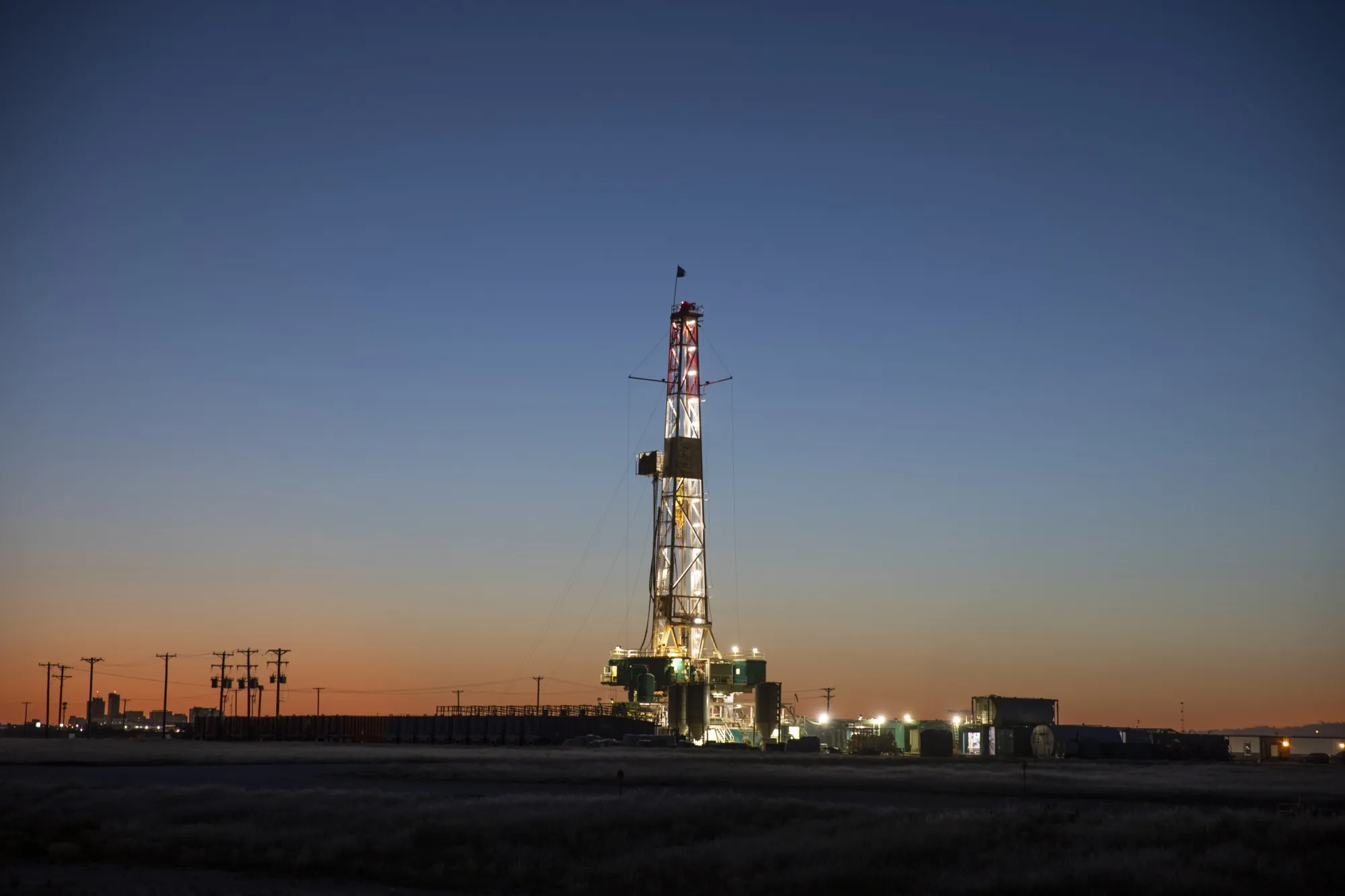 An&nbsp;oil drilling rig stands in Midland, Texas.