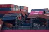 Dislodged containers on the One Apus container ship, berthed at the Kobe Port in Hyogo, Japan, on Thursday, Dec. 10, 2020. The vessel, managed by NYK Shipmanagement Pte, suffered a massive stack collapse and lost 1,816 containers - 64 of which are classified as dangerous goods - at sea due to severe weather on Nov. 30 while it was en route from Yantian, China to Long Beach, U.S.