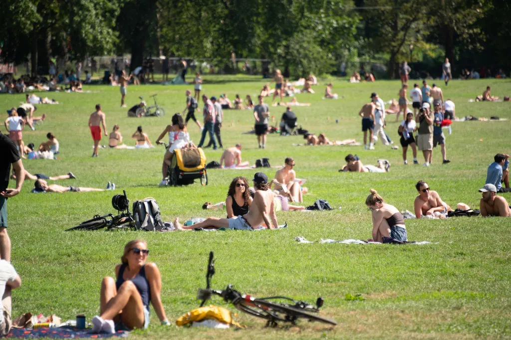 People meet friends at Sheep Meadow in New York City’s Central Park over Labor Day Weekend in 2021.