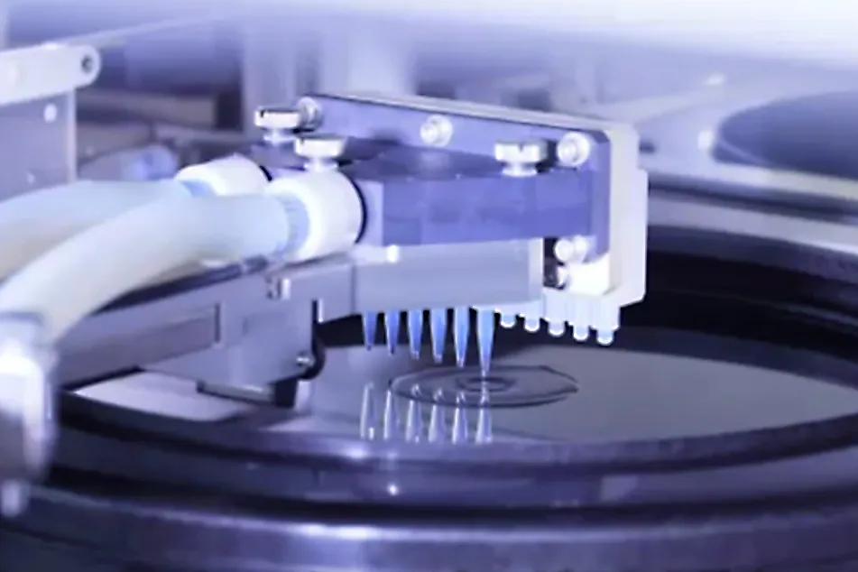 Applying photoresist to silicon wafer at Tokyo Ohka Kogyo.