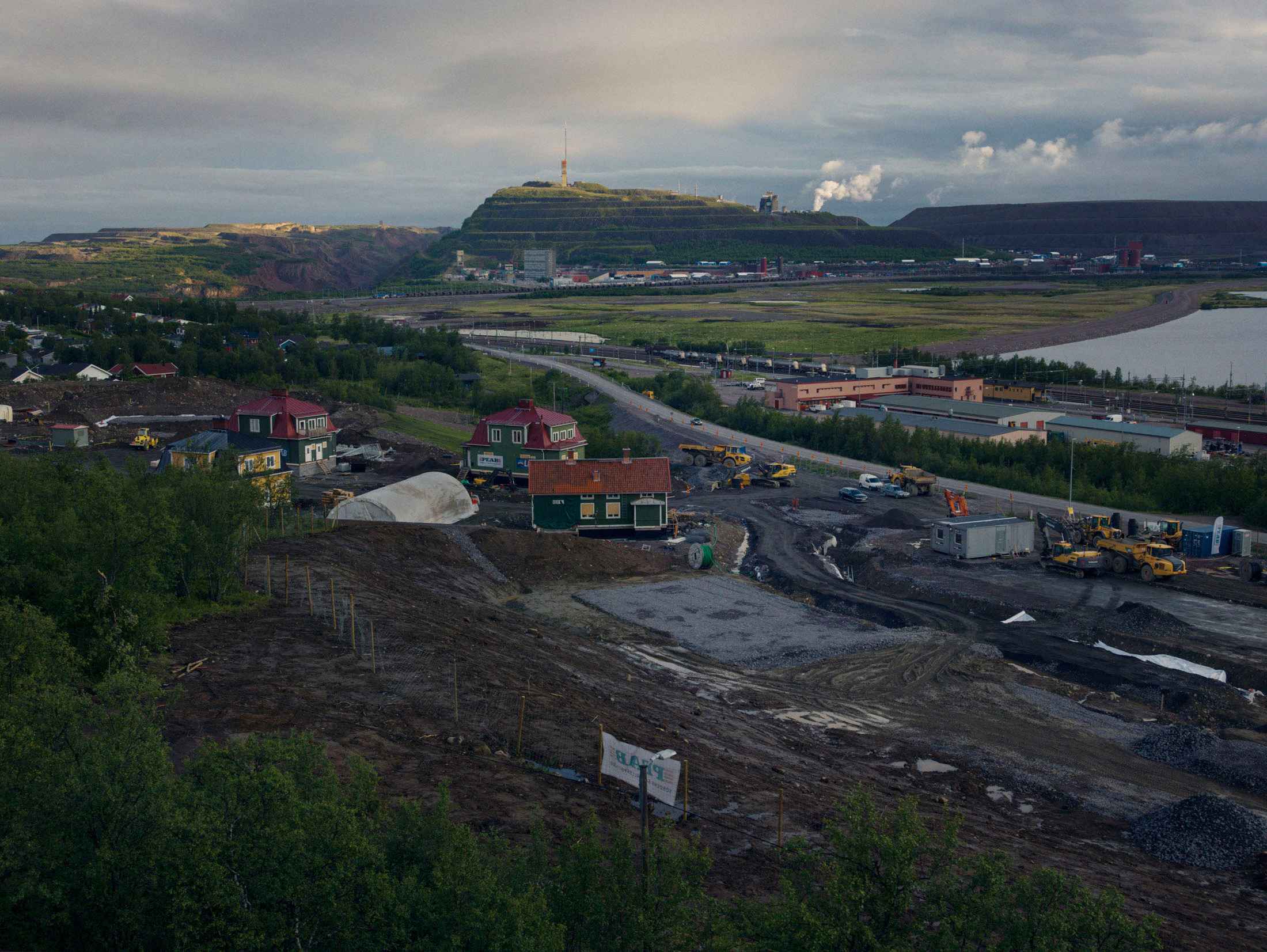 Kiruna, Sweden, and the Kirunavaara mine. Historic houses have been moved to what will be a new part of town.