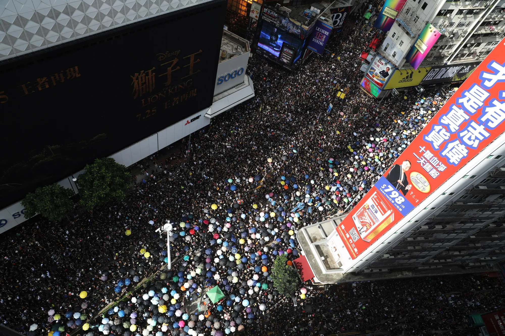 Demonstrators march through the Causeway Bay district of Hong Kong on July 21.