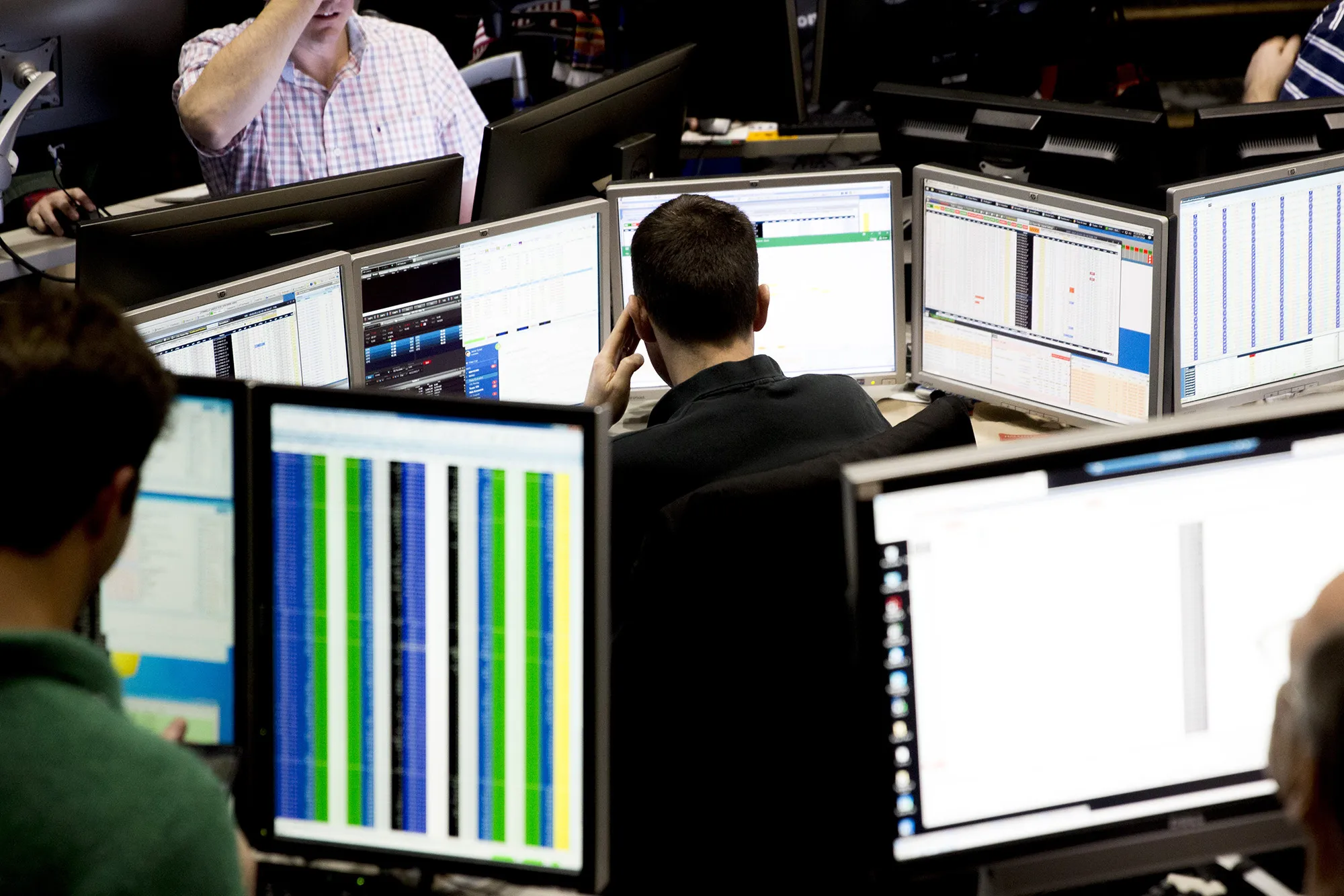 A trader looks over computer monitors at&nbsp;the Cboe Volatility Index pit on the floor of the CBOE Global Markets exchange in Chicago.