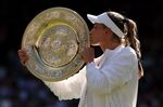 Elena Rybakina&nbsp;kisses the trophy after winning. the Ladies' Singles Final match during The Championships Wimbledon 2022 at All England Lawn Tennis and Croquet Club on July 9.