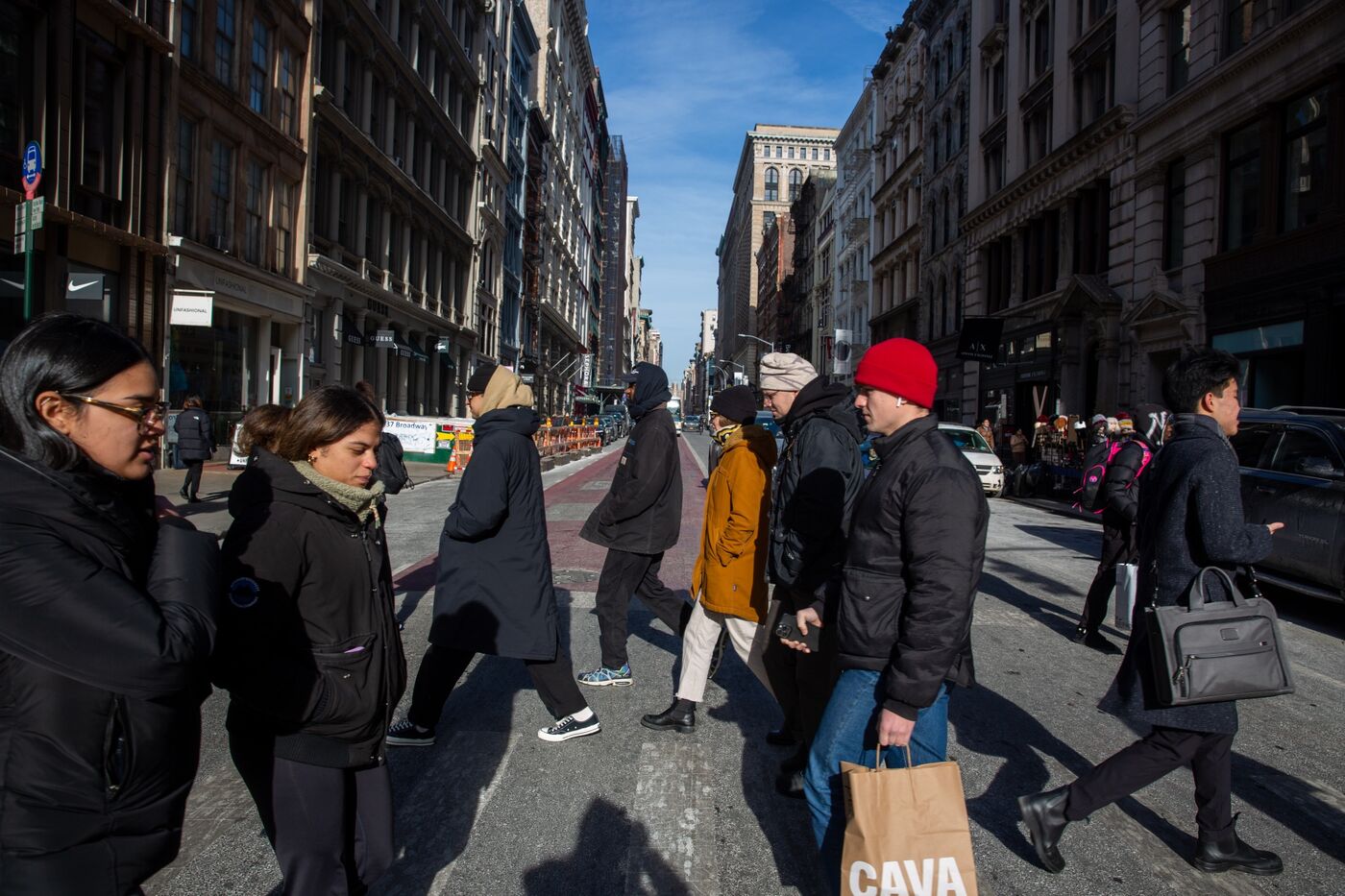 Shoppers and pedestrians on Broadway in the Soho neighborhood of New York, US