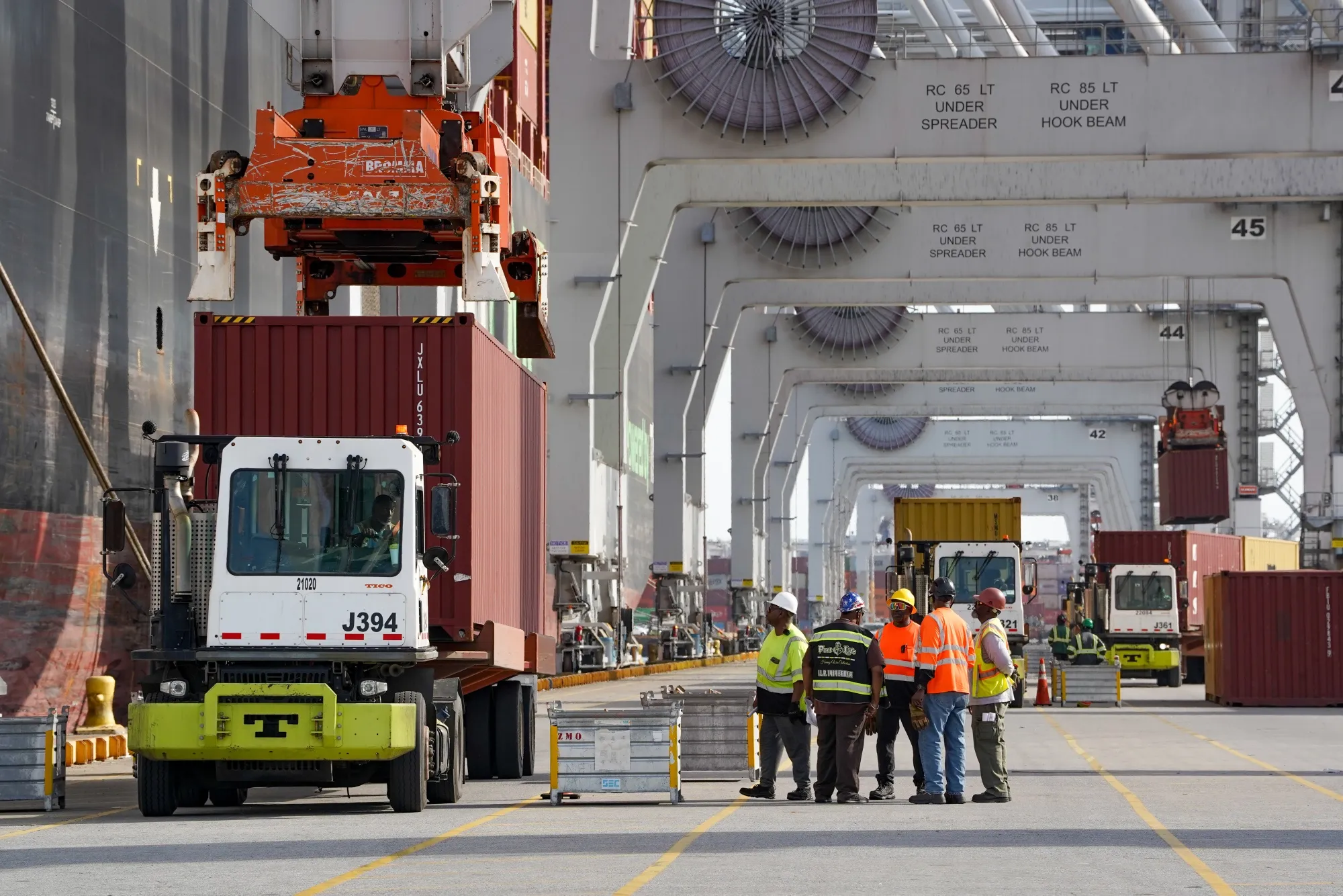 A container is placed on a truck after being offloaded from a ship at the Port of Savannah in Savannah, Georgia, US, on Wednesday, March 11, 2026.