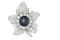 A sapphire and diamond brooch.