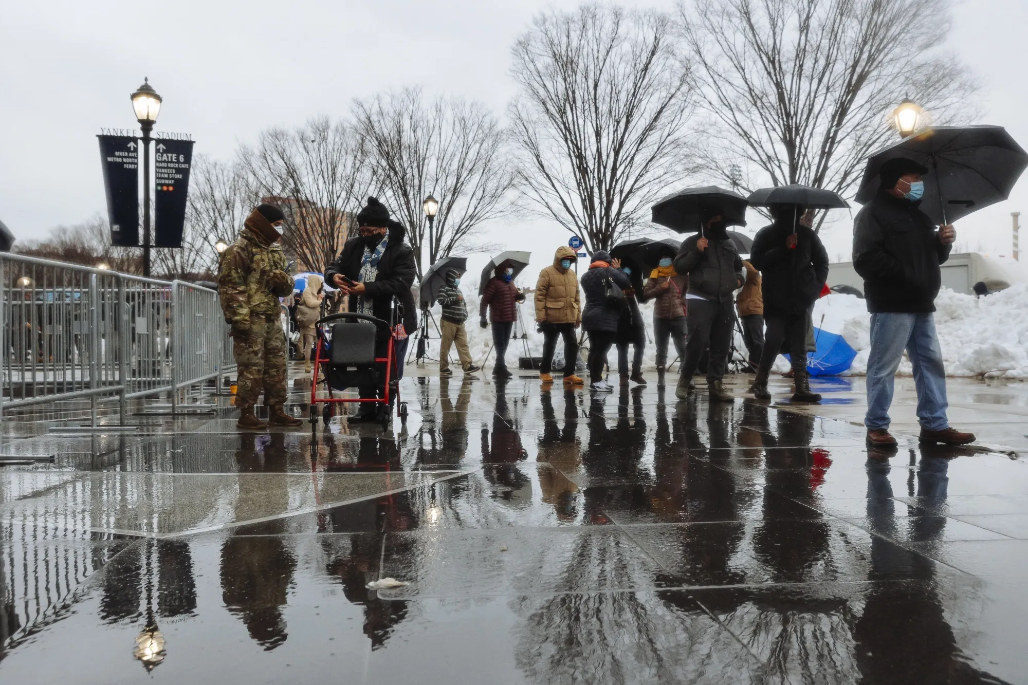 People line up outside a Covid-19 vaccination hub inside Yankee Stadium in the Bronx borough of New York on Feb. 5.