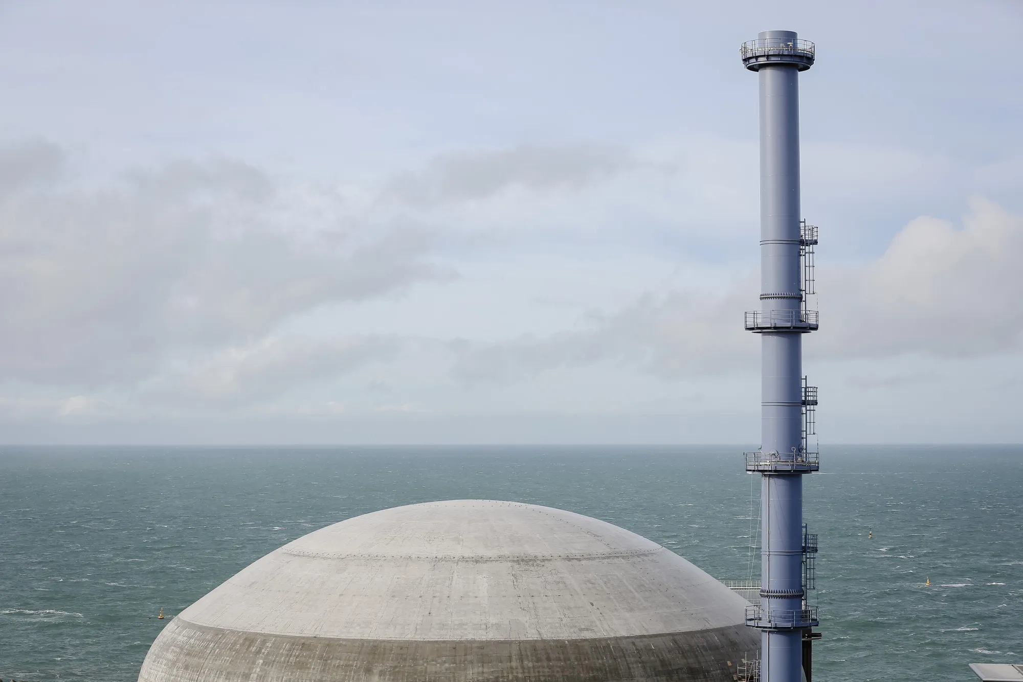 A domed containment building stands at Flamanville-3 reactor in Flamanville.