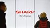 The logo of Sharp is displayed at a railway satation in Tokyo on February 17, 2017.