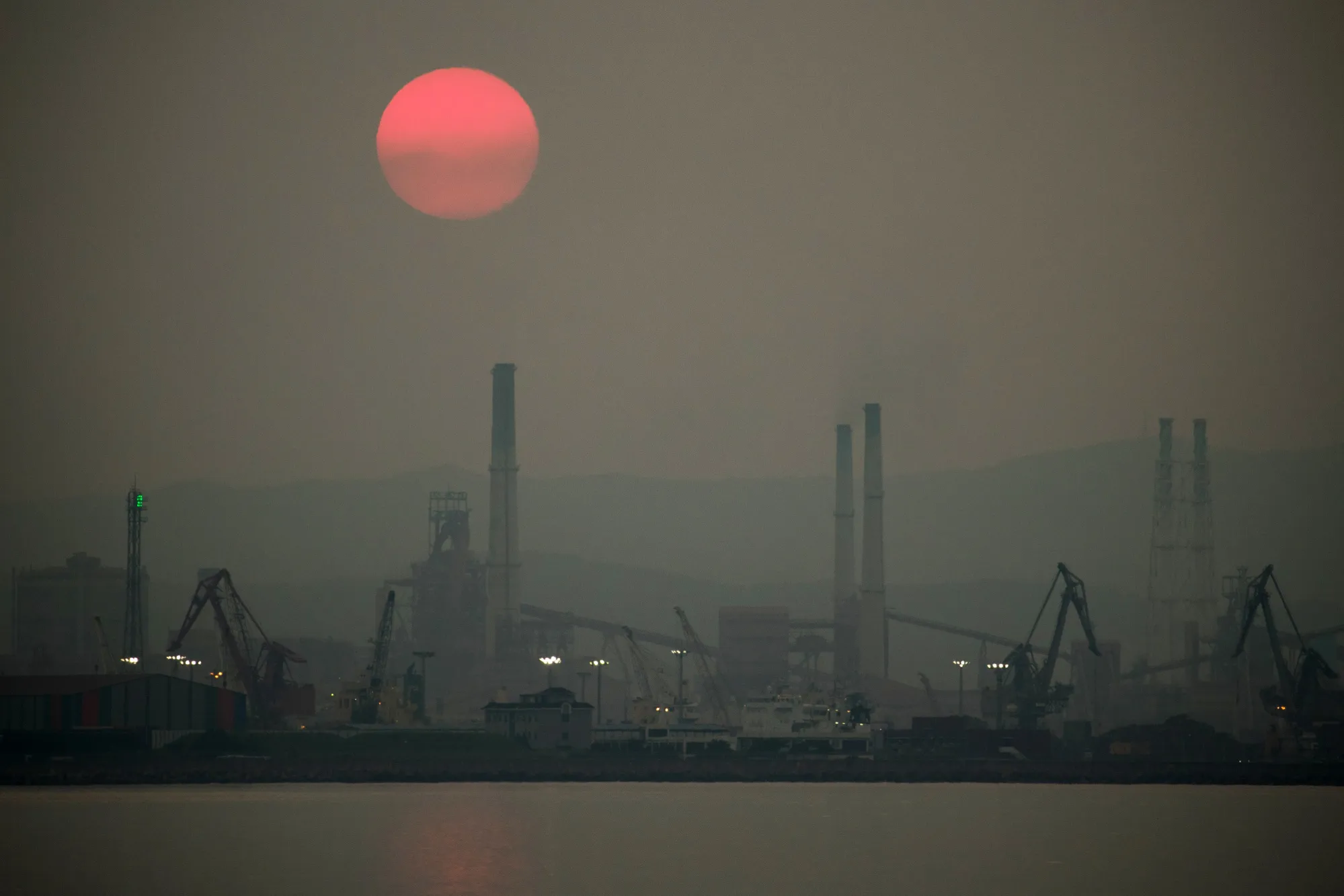 The sun sets over the Posco steel mill in Pohang, South Korea, on July 17, 2018. The city is increasingly&nbsp;

seen as the country’s new capital for the electric vehicle battery industry.&nbsp;