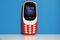 The new Nokia 3310 mobile phone, developed by HMD Global OY, in warm red, sits on display during a product launch event in London, U.K., on Friday, Feb. 24, 2017. Licensee HMD Global says more Nokia-branded models to launch in first half of 2017. Photographer: Luke MacGregor/Bloomberg