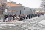 People wait in line outside one of a grocery store in Austin on Feb. 17. 