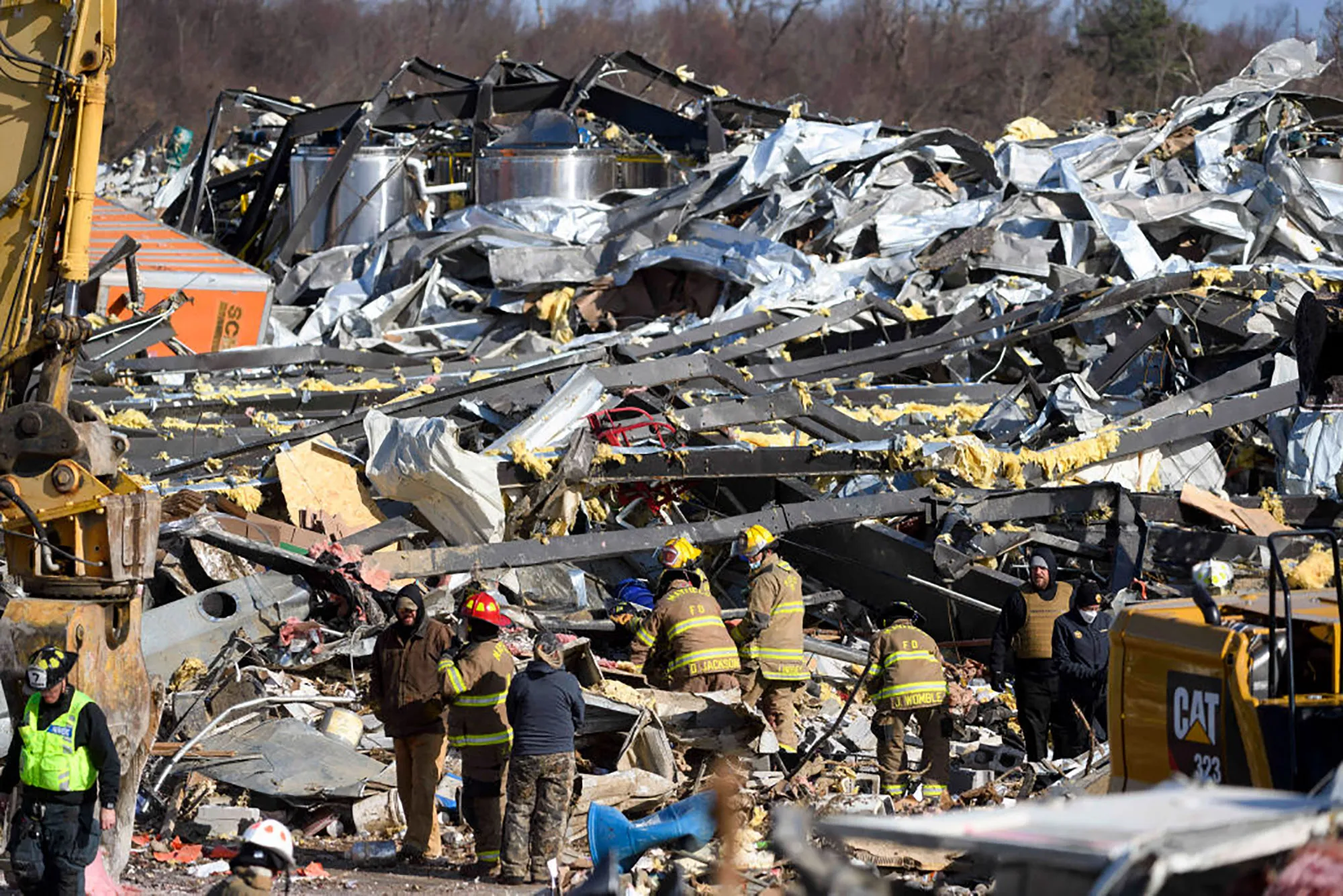 Emergency workers search through what is left of the Mayfield Consumer Products Candle Factory in Mayfield, Kentucky.&nbsp;