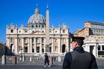 A police officer stands guard at the Vatican's Saint Peter's Square. 