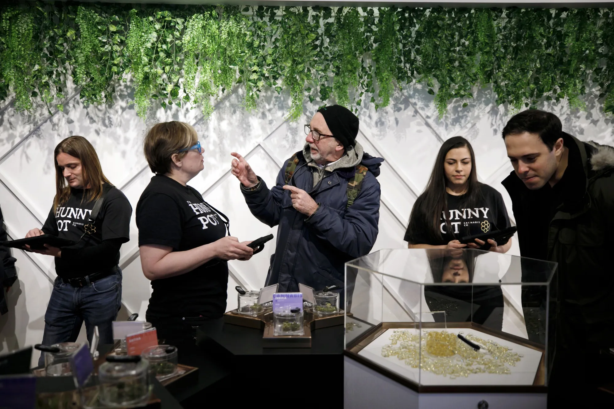 Customers shop inside of The Hunny Pot Cannabis Co. dispensary on April 1.
