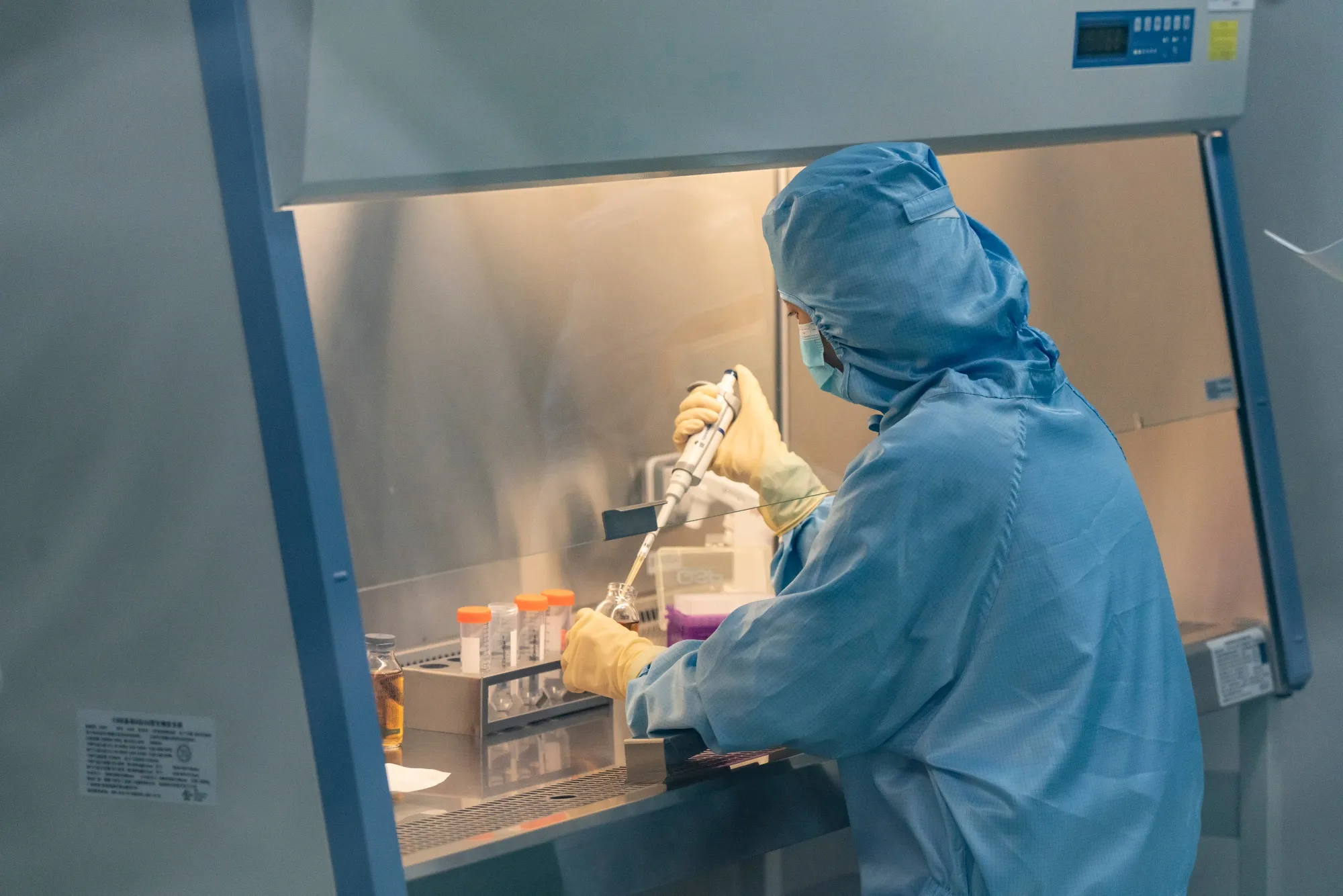 A technician in a production laboratory for cell therapies in Nanjing, China.