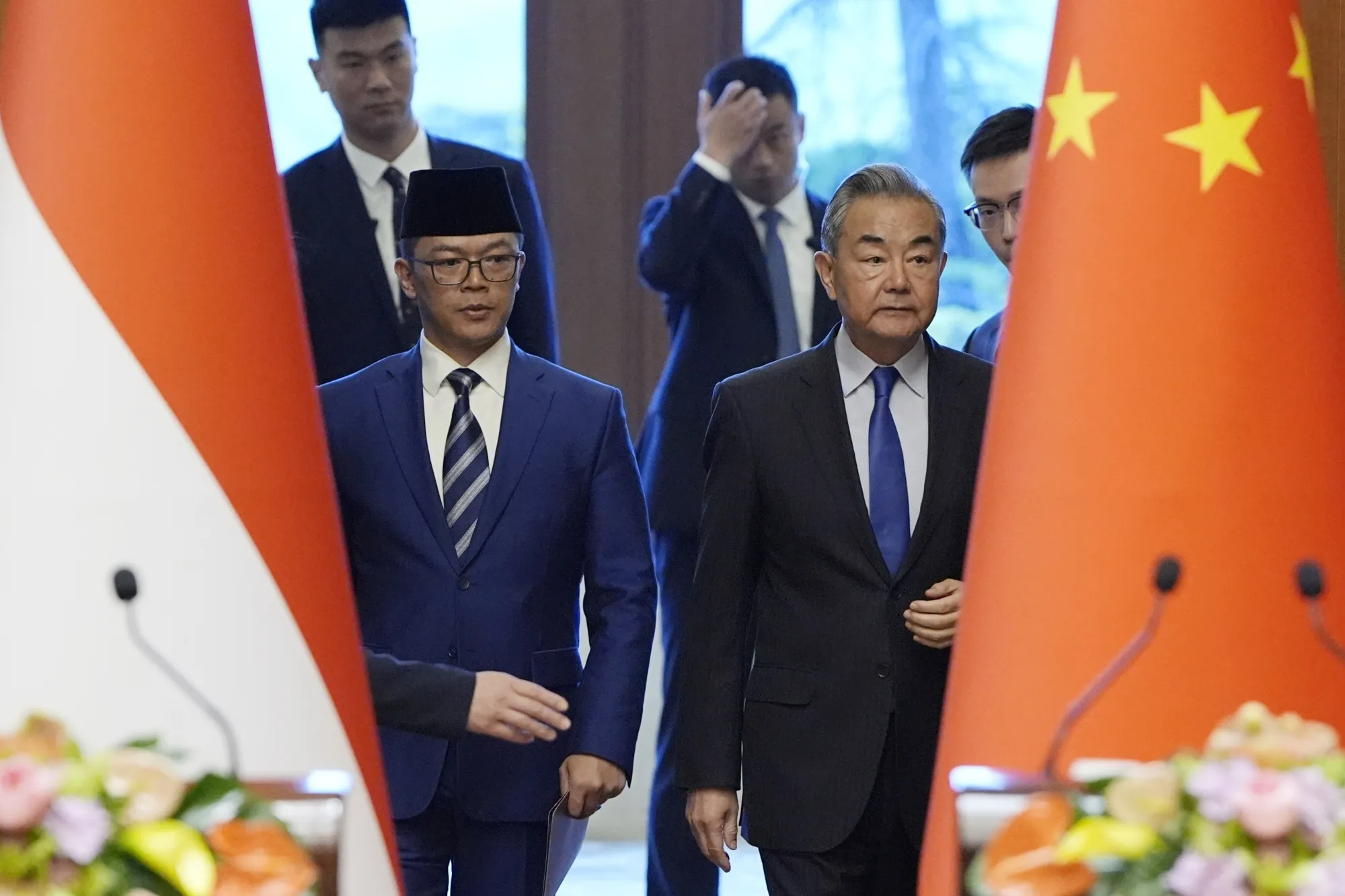Indonesian Foreign Minister Sugiono, left, and Chinese Foreign Minister Wang Yi in Beijing.