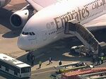 Emergency response crews gather outside the plane at JFK Airport on Sept. 5