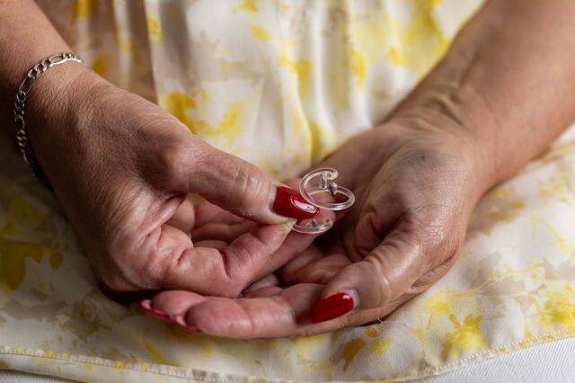 Breast cancer survivor Mary Munney Griffiths holds a Biozorb device.