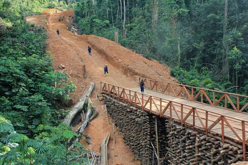 Workers for Alphamin Bisie Mining, a unit of Alphamin Resources Corp., build a 32 kilometer access road to the Bisie tin deposit by hand through the jungle in Walikale territory, eastern Democratic Republic of Congo.