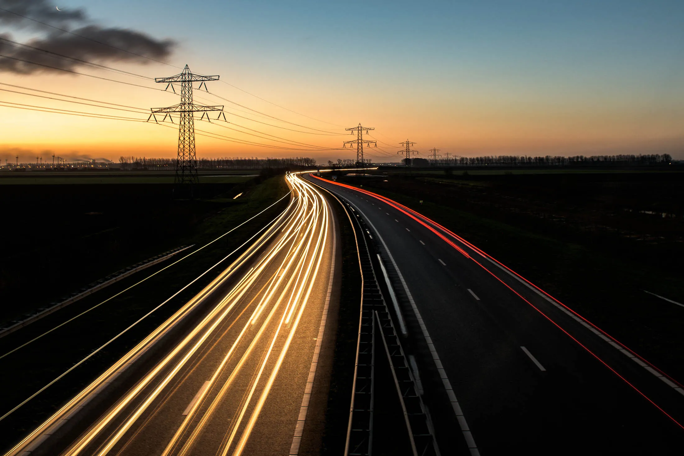 Light Trails On Road Against Sky During Sunset
