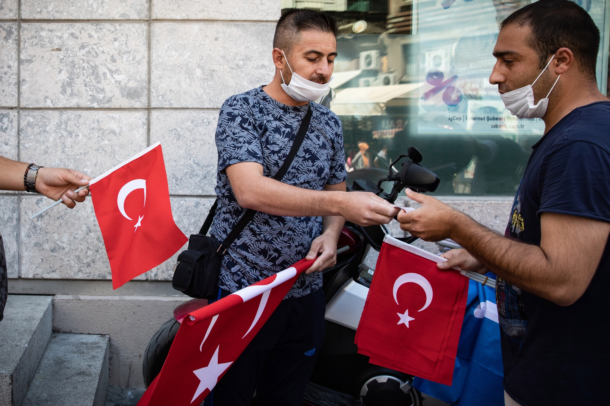 A street vendor sells Turkish national flags in the Eminonu district of Istanbul.