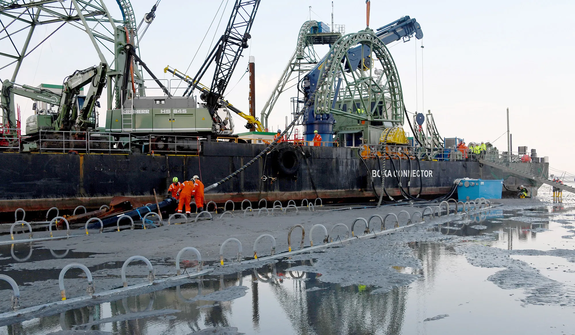 The end of the Nordlink&nbsp;cable is pulled ashore by a&nbsp;cable-laying vessel&nbsp;in Schleswig-Holstein, Büsum, Germany in 2019. NordLink directly connects the electricity markets of Germany and Norway.