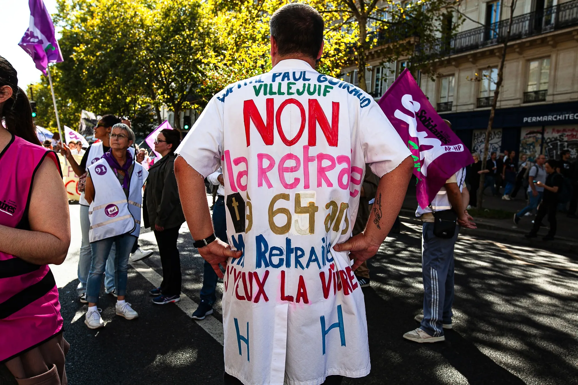 A protester demonstrates against&nbsp;the mandatory retirement age of 64 in Paris, in September.