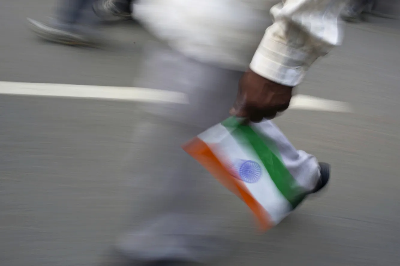A man carries an Indian flag in the border town of Attari, India.