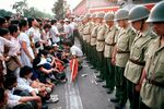 Pro-democracy demonstrators sat before soldiers guarding Communist Party headquarters in Beijing's Tiananmen Square on June 1, 1989