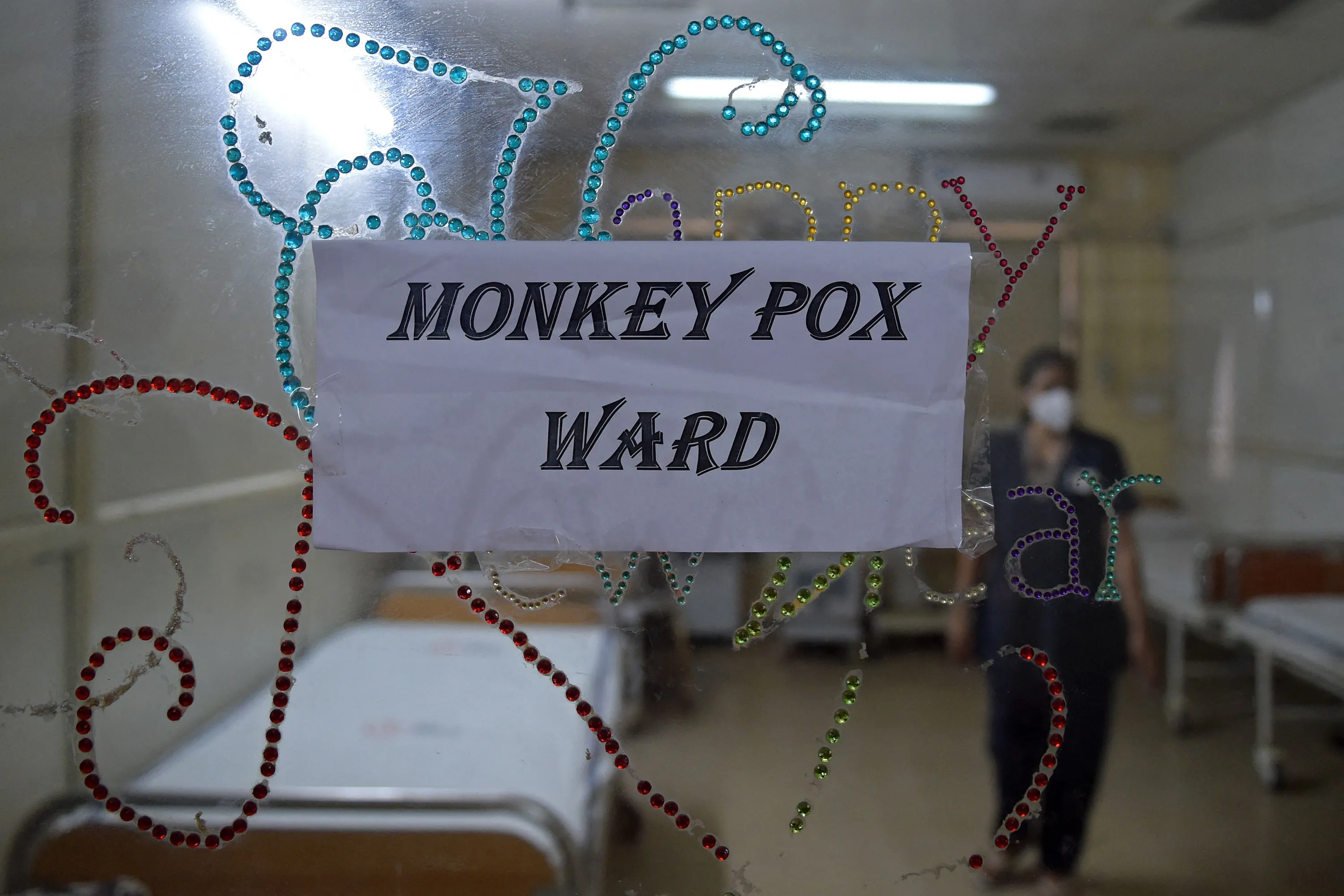 A health worker walks inside an isolation ward built as a precautionary measure for monkeypox patients at a hospital in Ahmedabad, on July 25.