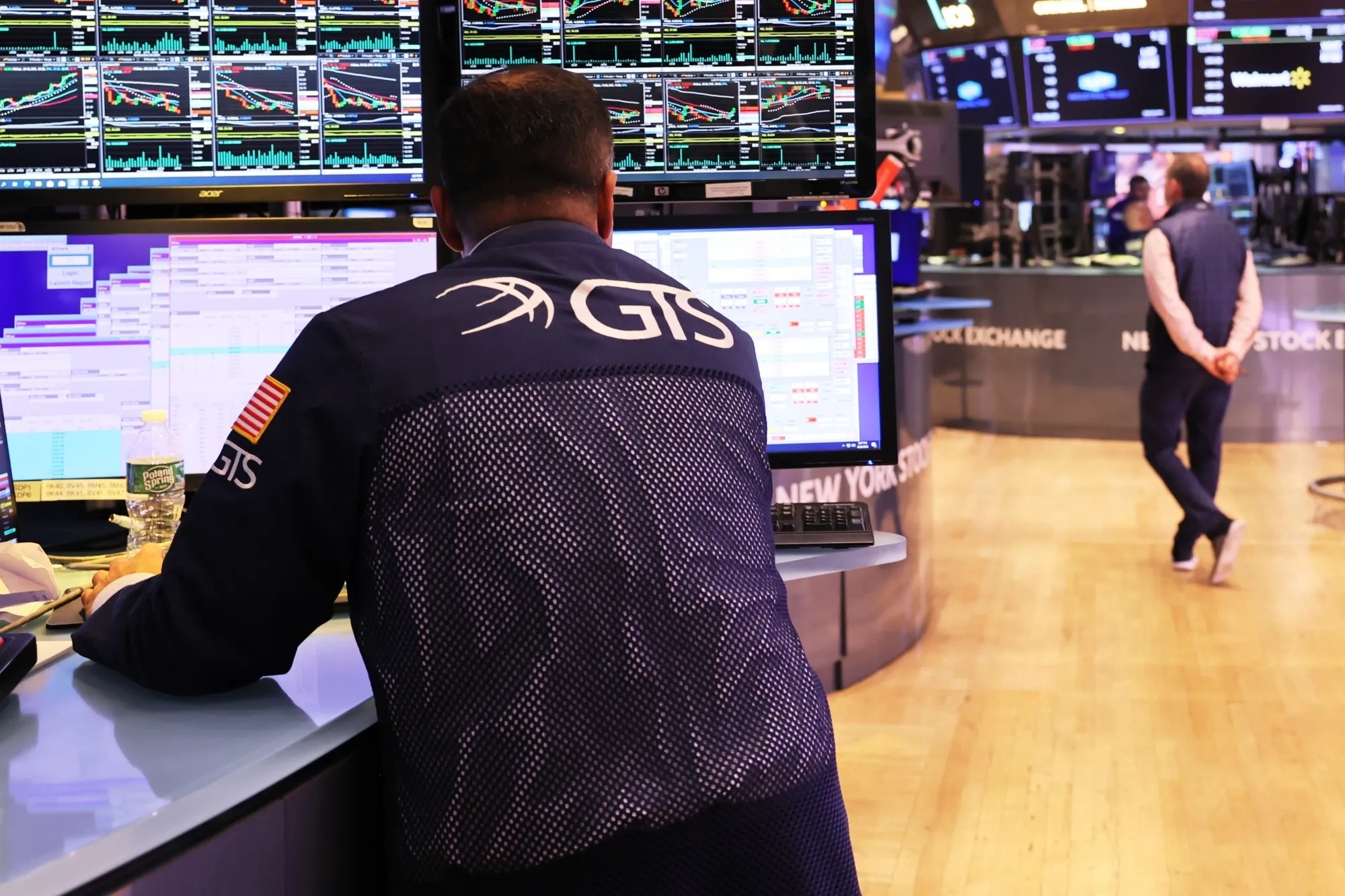 Traders work on the floor of the New York Stock Exchange.