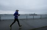 A lone runner in a Seattle waterfront neighborhood. 