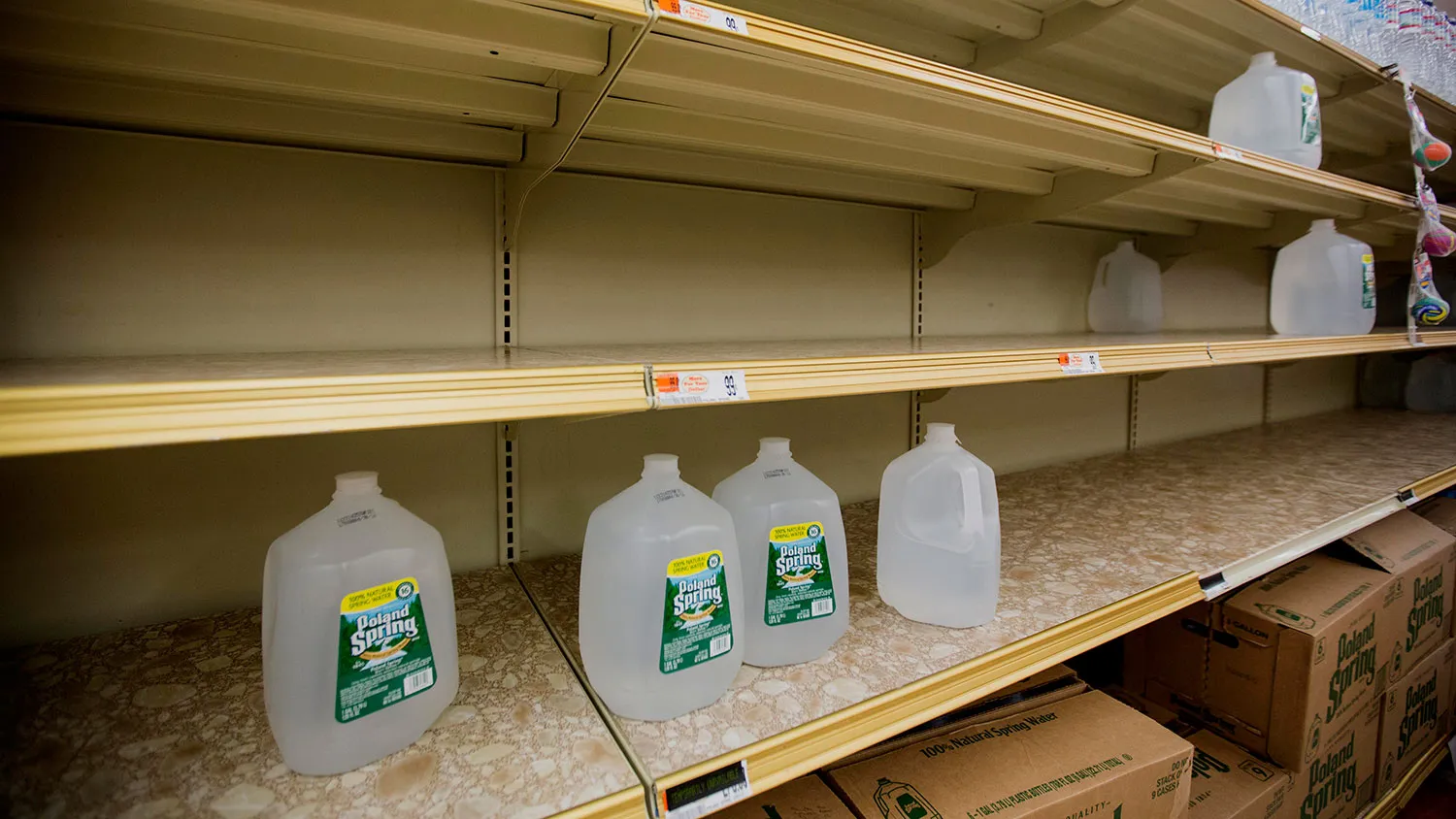 A shelf of water bottles sits nearly empty at Market Basket in Brockton, Massachusetts, U.S., on Monday, Jan. 26, 2015.
