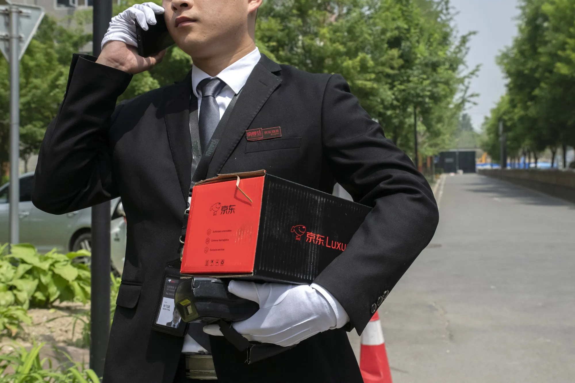 A driver for JD.com’s luxury service delivers a parcel in Beijing.