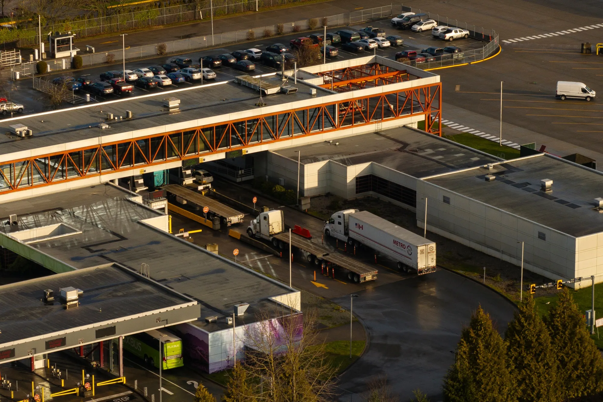 Tractor trailers entering Canada from the United States at the Pacific Highway Border Crossing in Blaine, Washington.