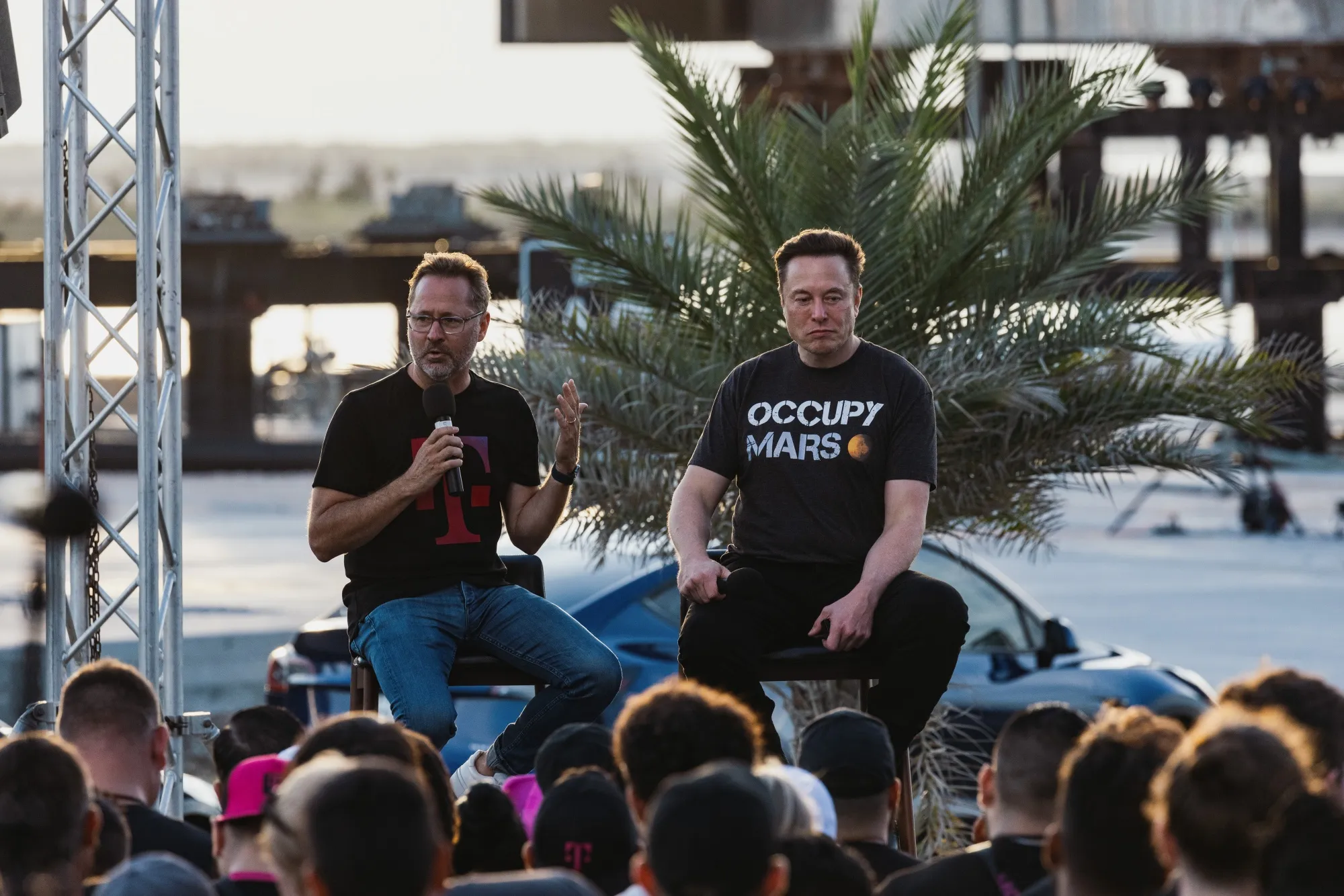 Mike Sievert, left, with Elon Musk at the SpaceX Starbase facility in Boca Chica, Texas, in 2022. 
