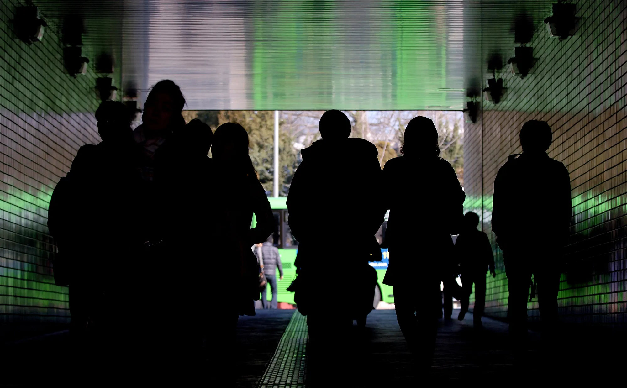 Pedestrians walks through a tunnel in Seoul.