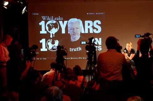 Assange participates, via video link, at a news conference with WikiLeaks journalist Sarah Harrison (right) in Berlin on Oct. 4, 2016.