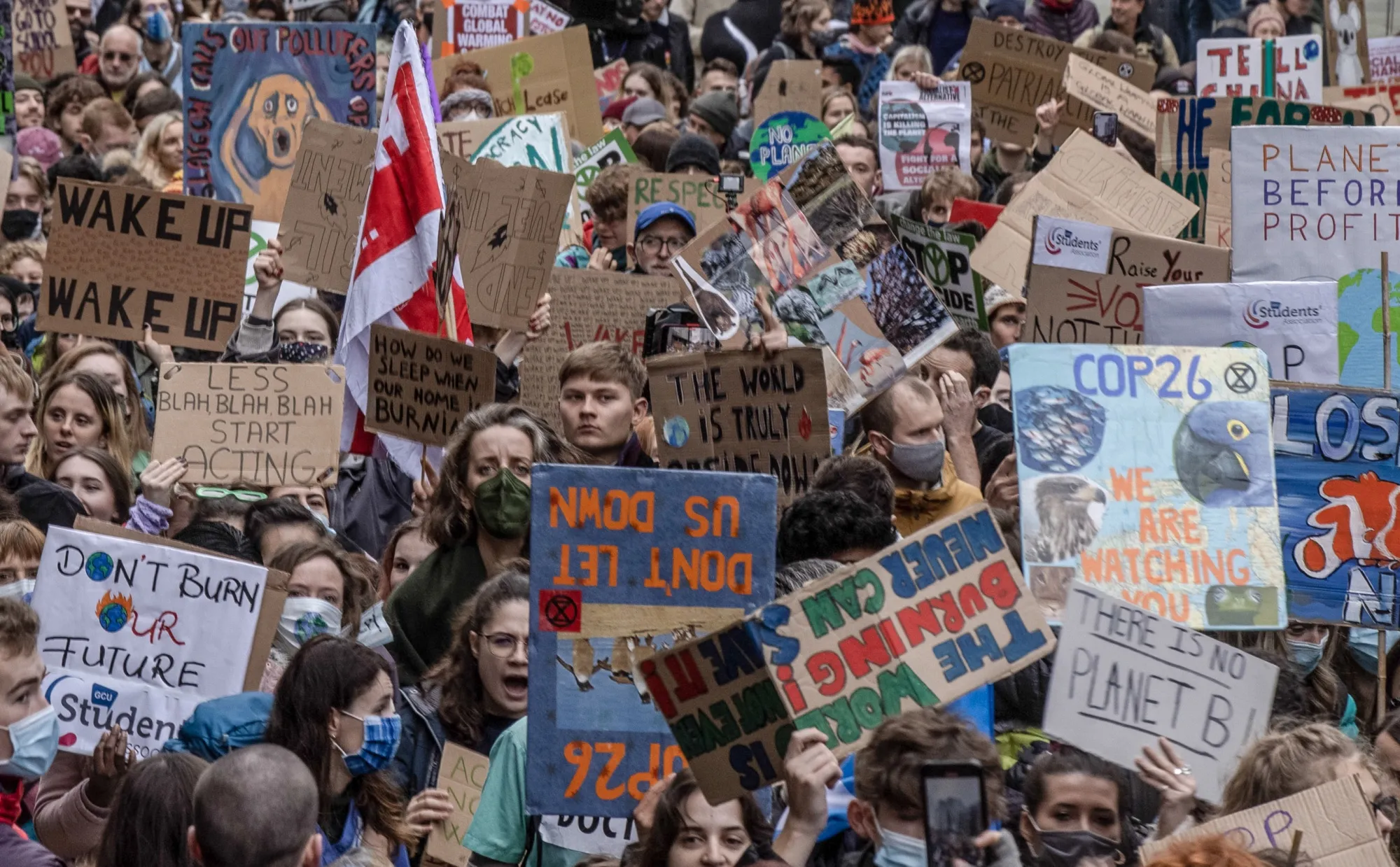 Climate activists march during a protest on the "Youth Day" at the COP26 climate talks in Glasgow, U.K., on Friday, Nov. 5, 2021. Climate negotiators at the COP26 summit were banking on the worlds most powerful leaders to give them a boost before they embark on two weeks of fraught discussions over who should do what to slow the rise in global temperatures.