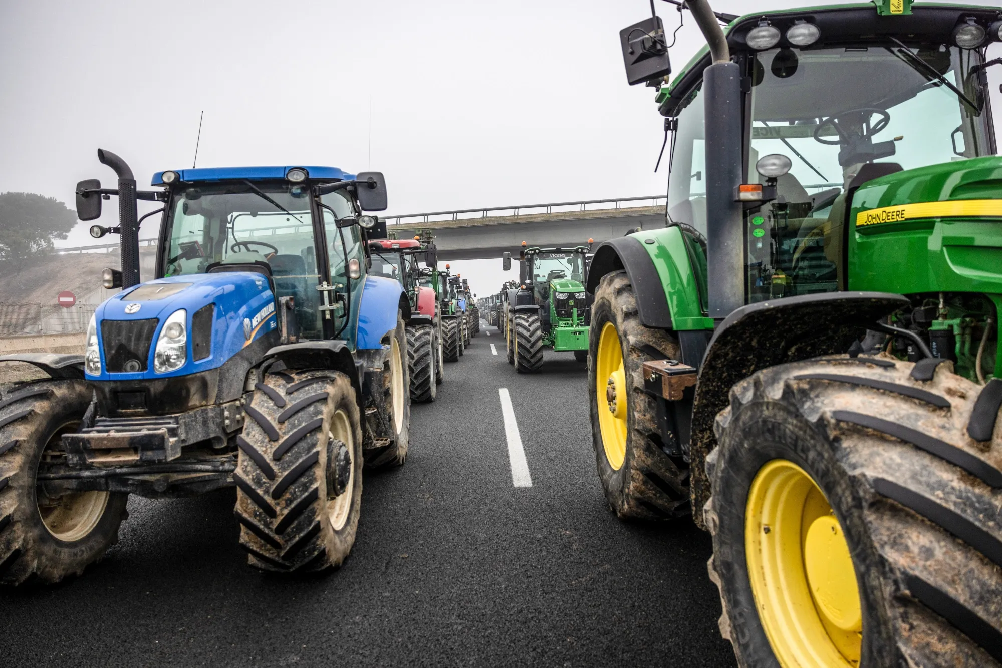 Farmers block the A2 Highway with their tractors during a protest in Fondarella, Spain, on Feb. 6.