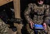 Ukrainian drone pilot in his military shelter on the Sumy