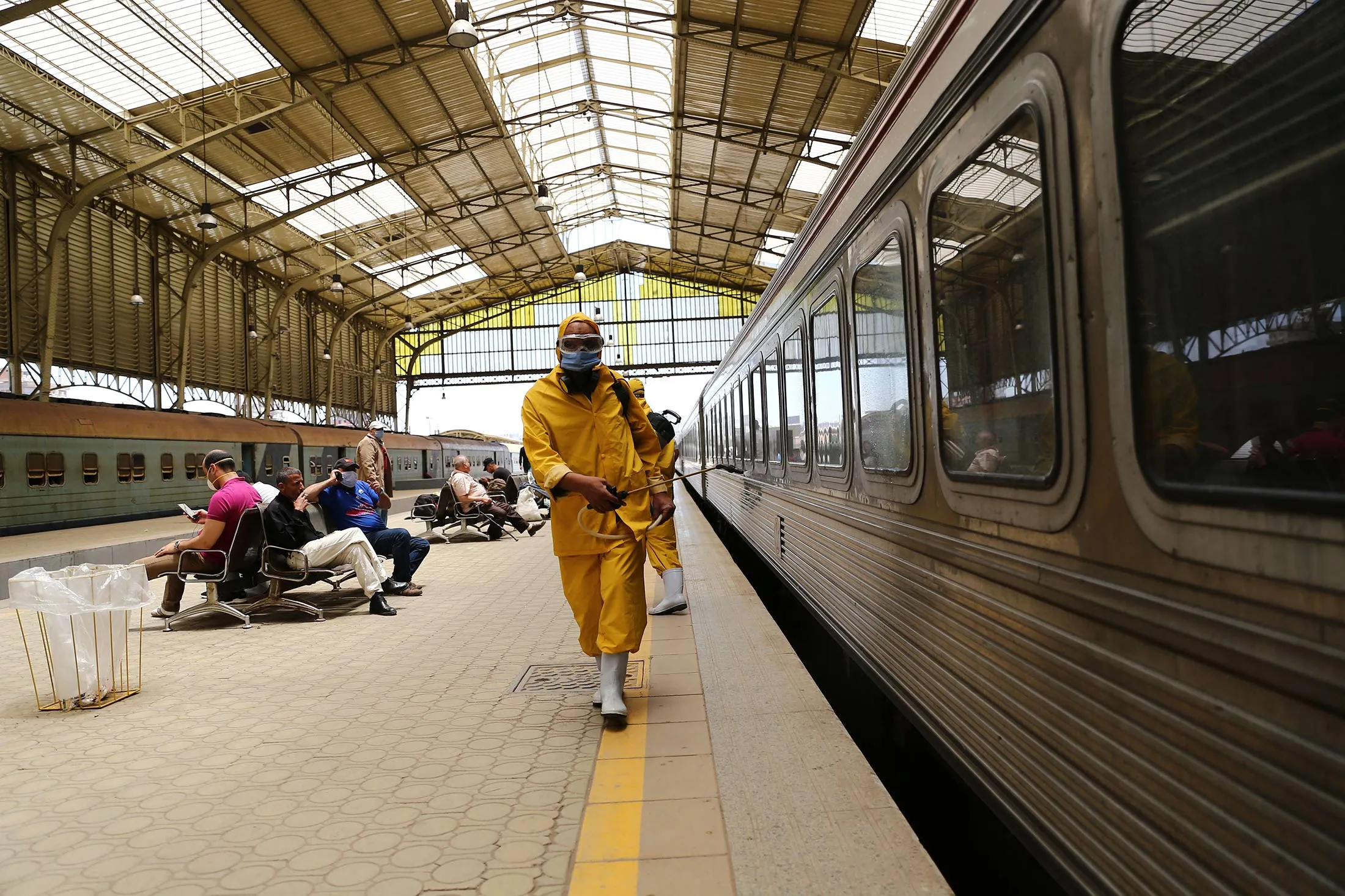 Workers spray disinfectant at a railway station in Cairo, Egypt&nbsp;on May 31.