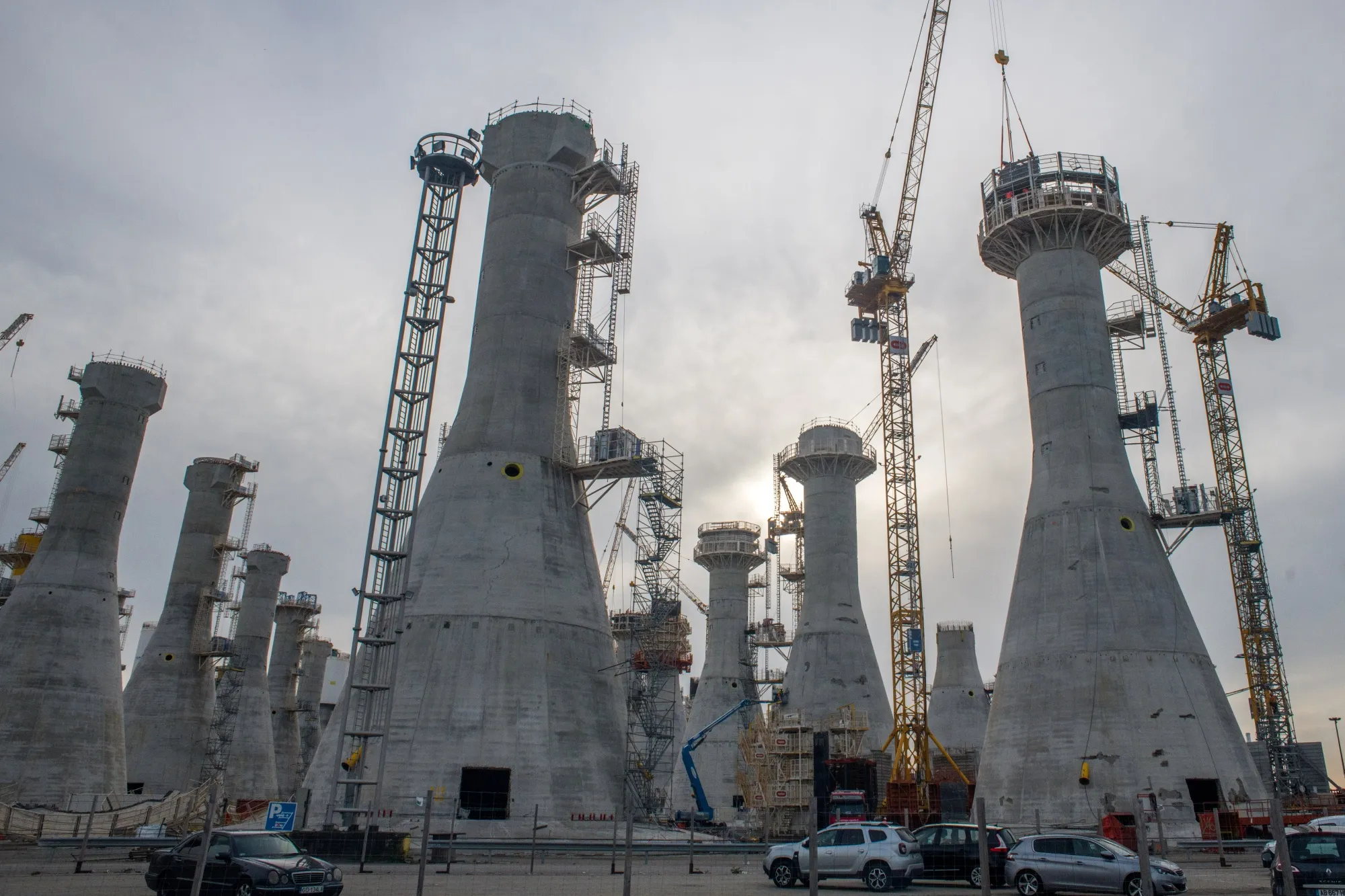 Cranes at the construction site of gravity-based wind turbine foundations for an&nbsp; offshore wind farm&nbsp;in Le Havre, France.