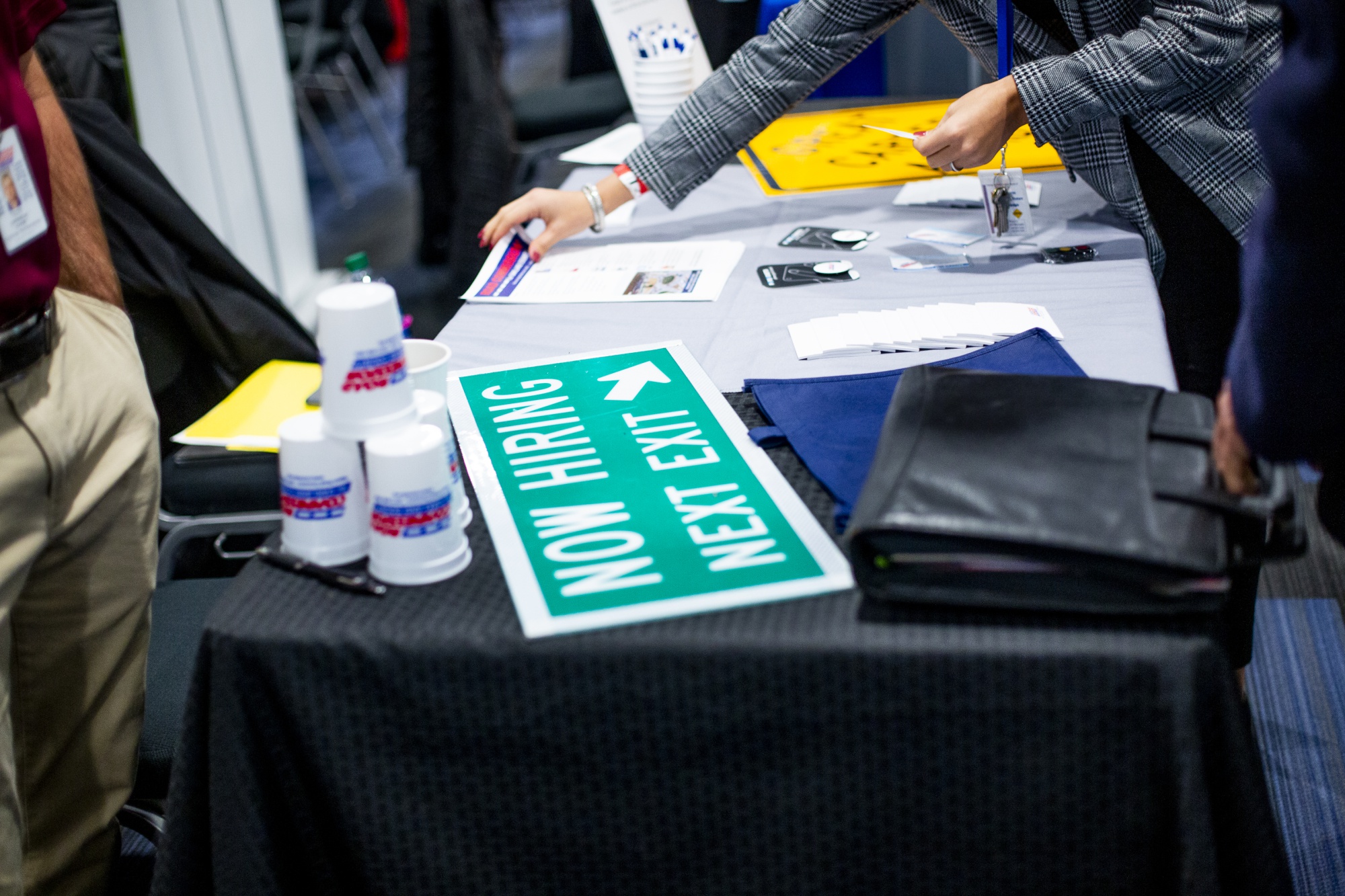 Job seekers speak with representatives at a job fair in Detroit.