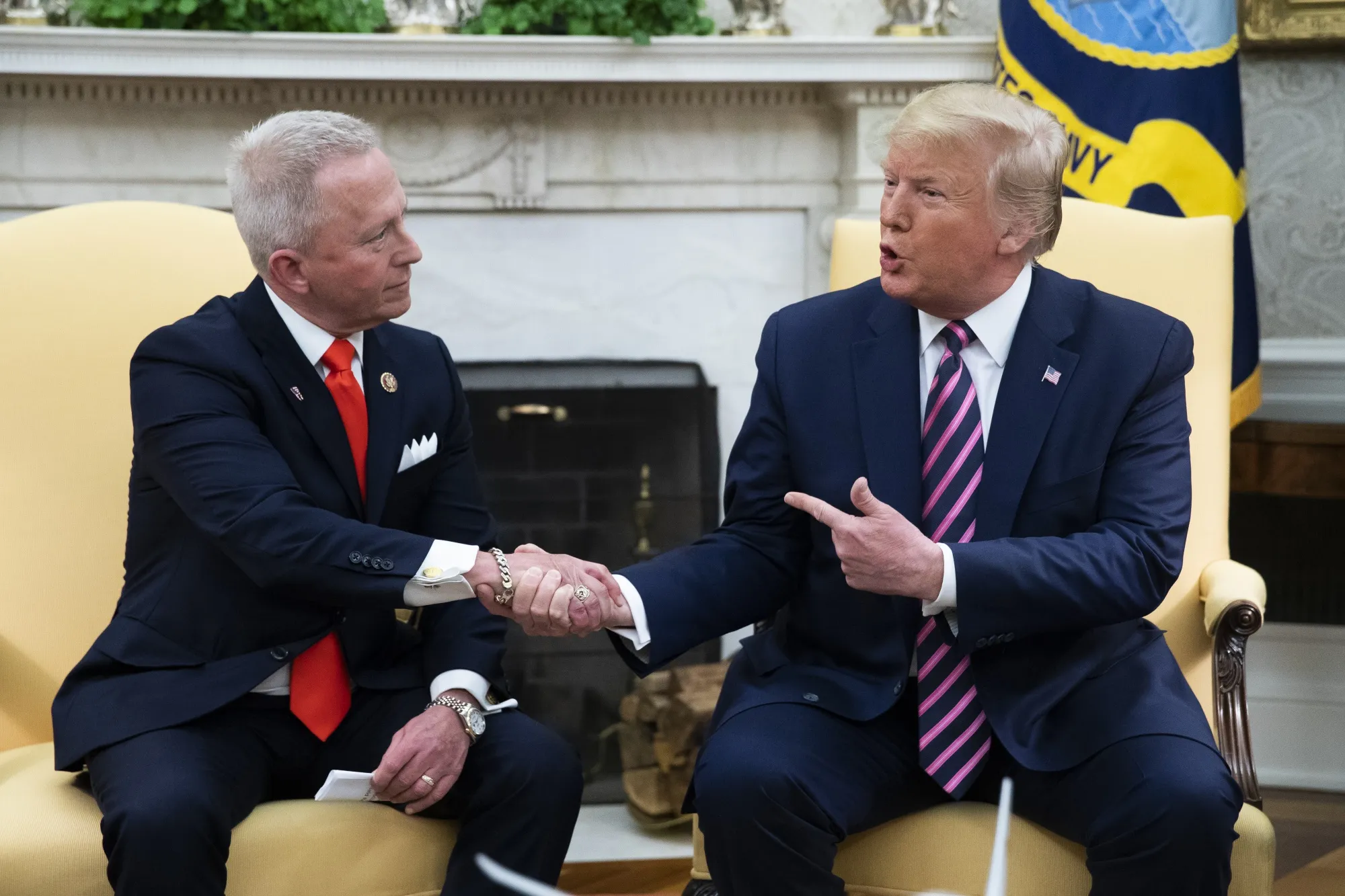 Donald Trump shakes hands with Jeff Van Drew in the Oval Office of the White House on Dec. 19.