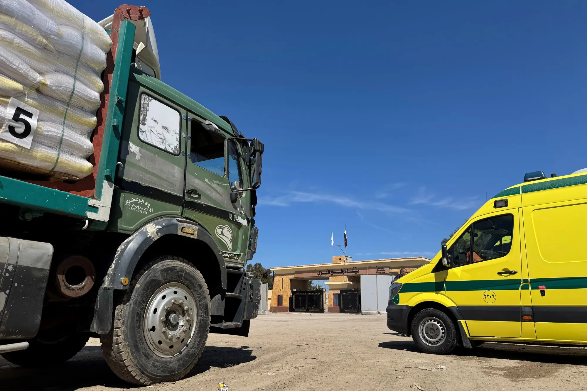 Trucks carrying humanitarian aid and ambulances line up on the Egyptian side of the Rafah border on March 2.
