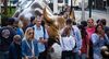 Tourists visit the Charging Bull sculpture near the New York Stock Exchange (NYSE) in New York.